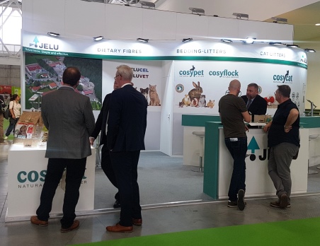 JELU sales representatives engaged in conversation with potential customers